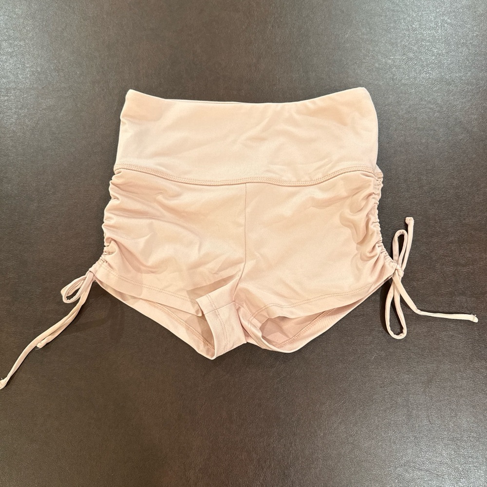 High-waisted pink athletic booty shorts with adjustable ties size small